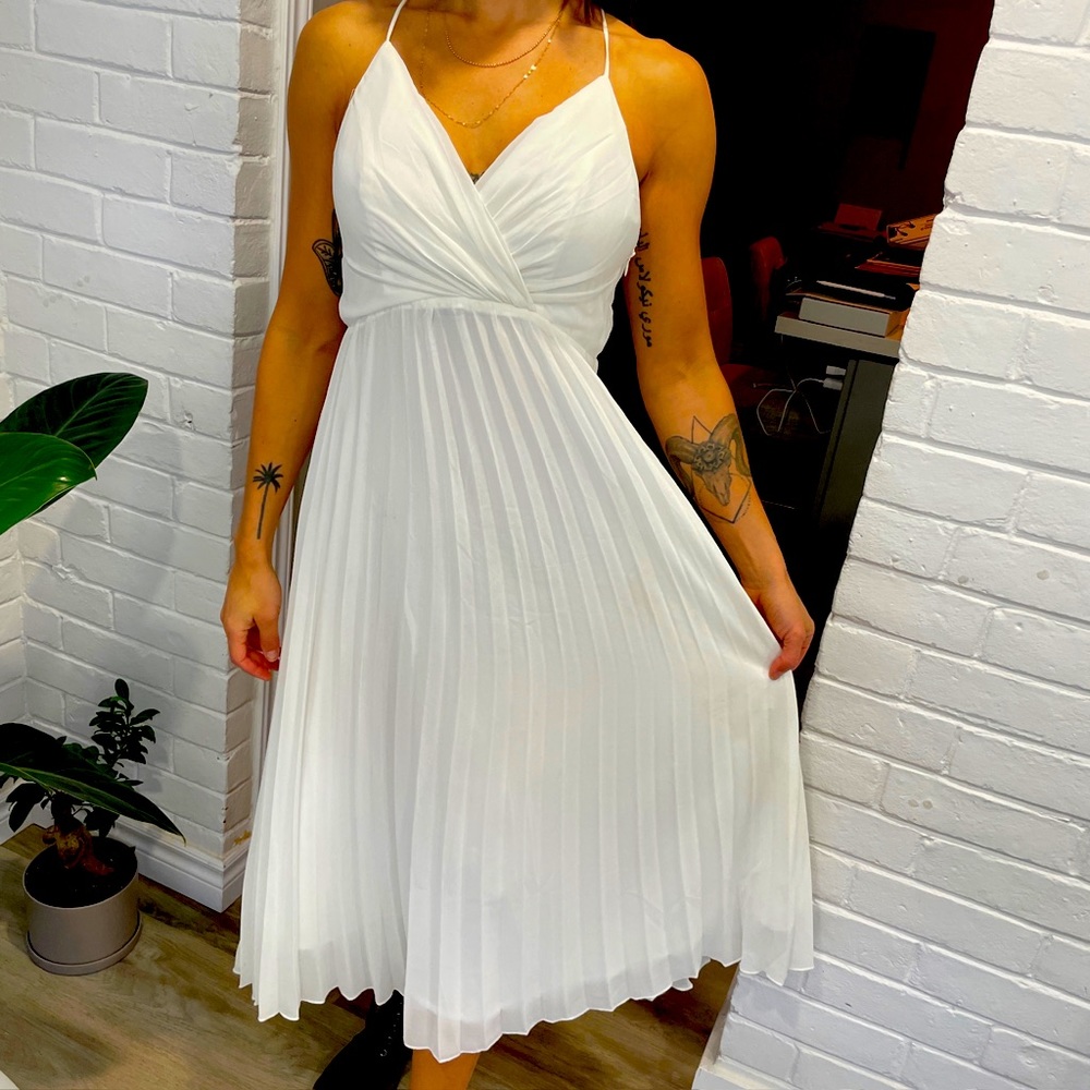 Beautiful size 4 dress. Open back.  Light weight.